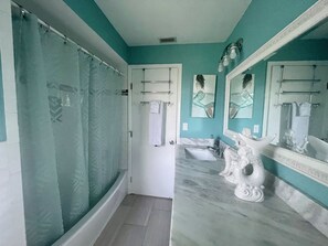 Guest bathroom, double vanity, comfort height toilet w/ bidet and shower/tub. 