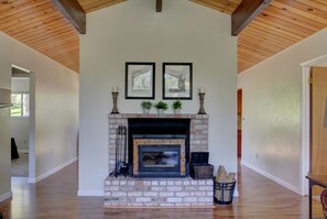 Fireplace with beautiful drawings of the area above from a local artist. 