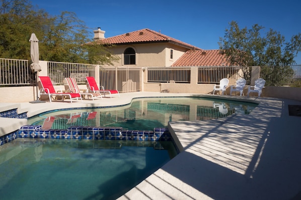 Rear view of house completely private with pool and attached spa mountain views