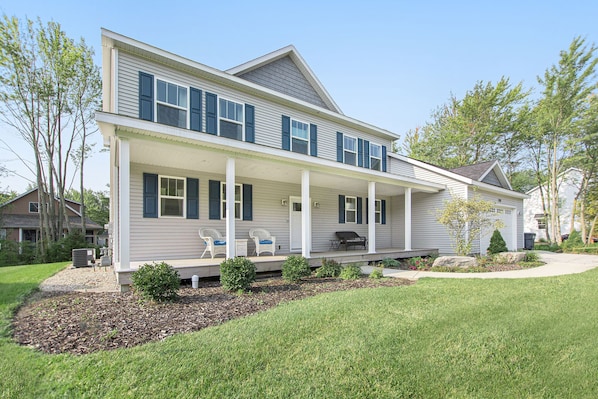 Front of house with spacious front porch. 