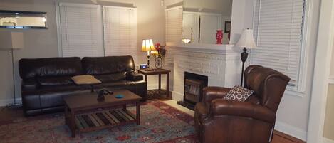 Living room with electric reclining furniture. 