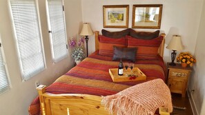 Queen bed with Bed Bath and Beyond linens; view towards labyrinth