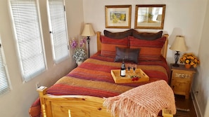 Queen bed with Bed Bath and Beyond linens; view towards labyrinth
