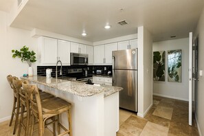 Kitchen with granite countertops and stainless steel appliances