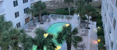 View of pool courtyard and Gulf of Mexico from the unit balcony.