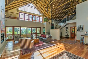 The double volume sun kissed lounge is a welcome entrance to a beautiful home.