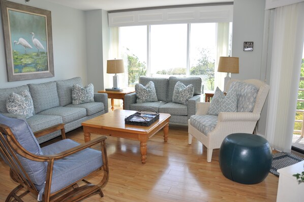 Living Room m with comfy couches and chairs and Ocean Views.  New Furniture 2024