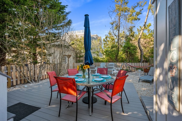 Fully fenced backyard with outdoor table and a FIRE TABLE for cooler nights!