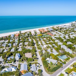 West facing aerial views of the house with relation to the Gulf.