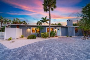 Beautiful new exterior and driveway with ample room for 3 vehicles.