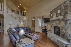 Kick your feet up and relax in front of the stone fireplace.