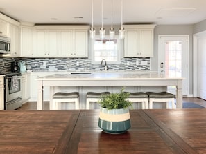 Large kitchen island to gather round. Fully stocked along with a Keurig.