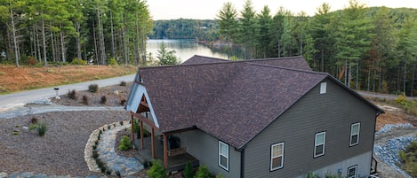 View as you pull up to home, stone stairway to front entrance and side entrances