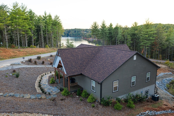 View as you pull up to home, stone stairway to front entrance and side entrances