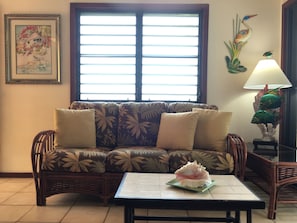 Living room off the kitchen with sliding door to veranda and steps to the BBQ.
