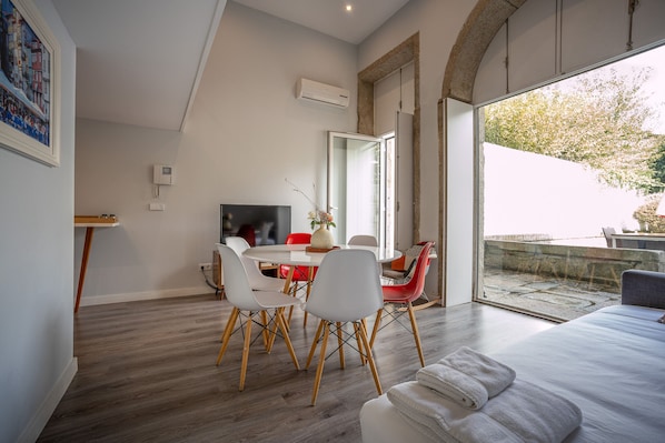 Dining room with sofa bed and outdoor space