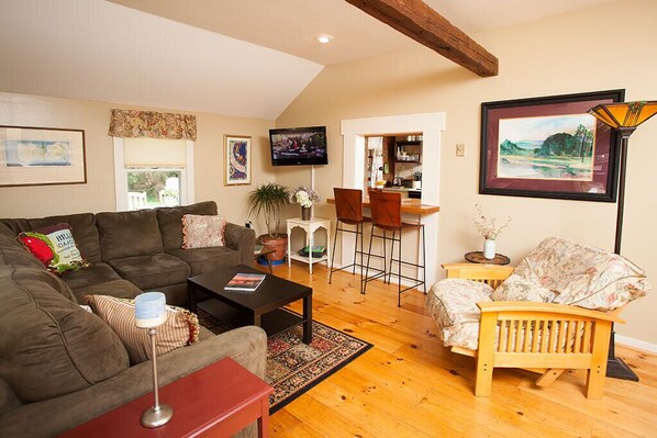 Living room w/large sectional couch, kitchen pass thru & new 32 LCD TV.