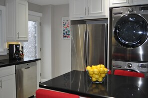 Stainless Steel refrigerator with ice maker.