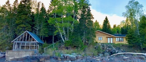 WoodSong cabin sits nestled into the wide expanse of Cascade River State Park.