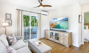 Watch a movie or the big game on the 65-inch (4k OLED Smart TV)