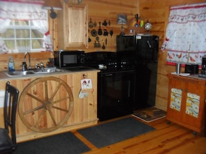 spacious full kitchen complete with everything needed for cooking and dining