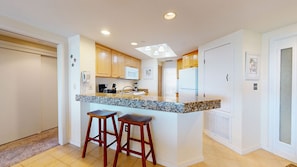 Fully Stocked Kitchen with Countertop Seating