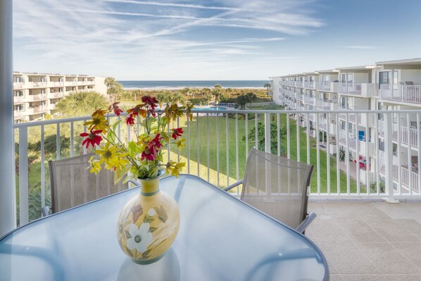 Patio - Ocean view patio features a table with seating for four. Perfect spot to relax and unwind!