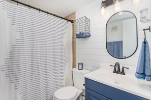 The hallway bathroom is shared between both bedrooms, but there is plenty of storage for everyone!