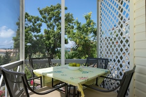 lush professionally maintined vegetation around porch and condominium grounds.