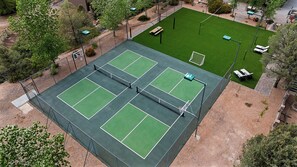 Private sports court with pickleball, basketball, volleyball, and turf field.