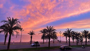 Sunset across the Baie des Anges viewed from apartment balcony