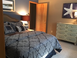 Bedroom with adjacent private half bath.