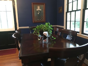 Dining room table seats 6 or 8 with added leaf.