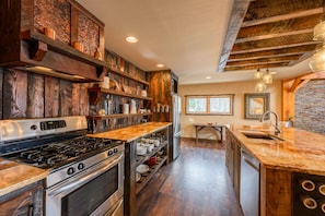 Custom Kitchen with Reclaimed Barn Wood and Hammered Copper Accents! Gas Cooktop