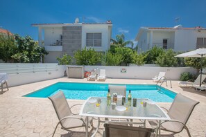 Garden with barbecue, seating area, sun loungers and private pool