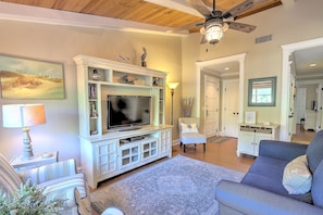 Living Room with Beamed Ceilings & Flat Screen TV