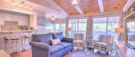 Living Room with Beamed Ceilings & Flat Screen TV