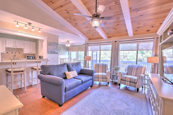 Living Room with Beamed Ceilings & Flat Screen TV