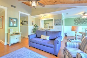 Living Room with Beamed Ceilings & Flat Screen TV