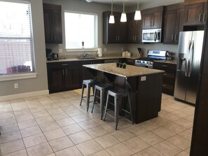 Fully stocked kitchen.  Bar seating for 3. 