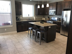 Fully stocked kitchen.  Bar seating for 3. 