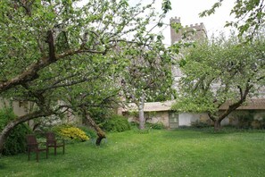 Garden with thatched wall - View from cottage bedroom window