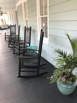 Spend time relaxing on the large private Charleston porch