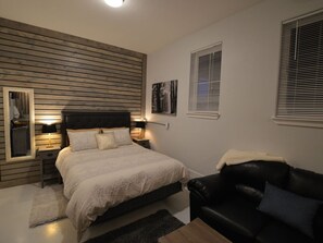 Cozy space with black leather loveseat!