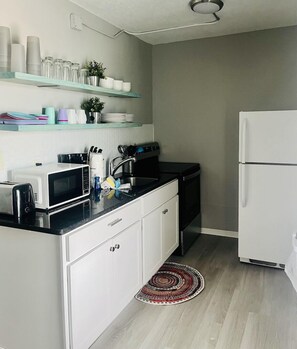 Kitchen equipped with the necessities needed during your stay.