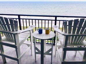 Tall Adirondack chairs. Look over the railing, not thru it!! 
