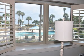 Look out the Living Room window and see and pool and the fam in the beach chairs