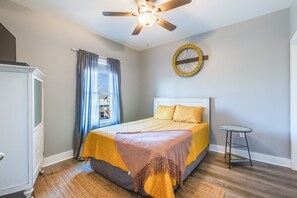 Guest bedroom upstairs with a queen sized bed & tv. Connected shared full size bathroom.