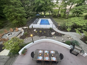 Resort-style back yard with dining patio, fire pit and heated pool