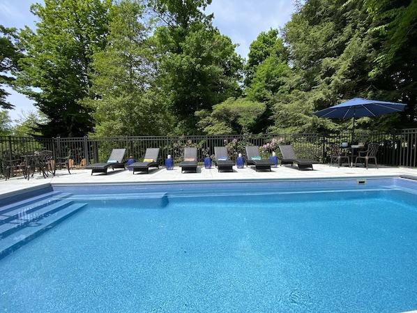 Heated, fenced, covered pool with seating ledges